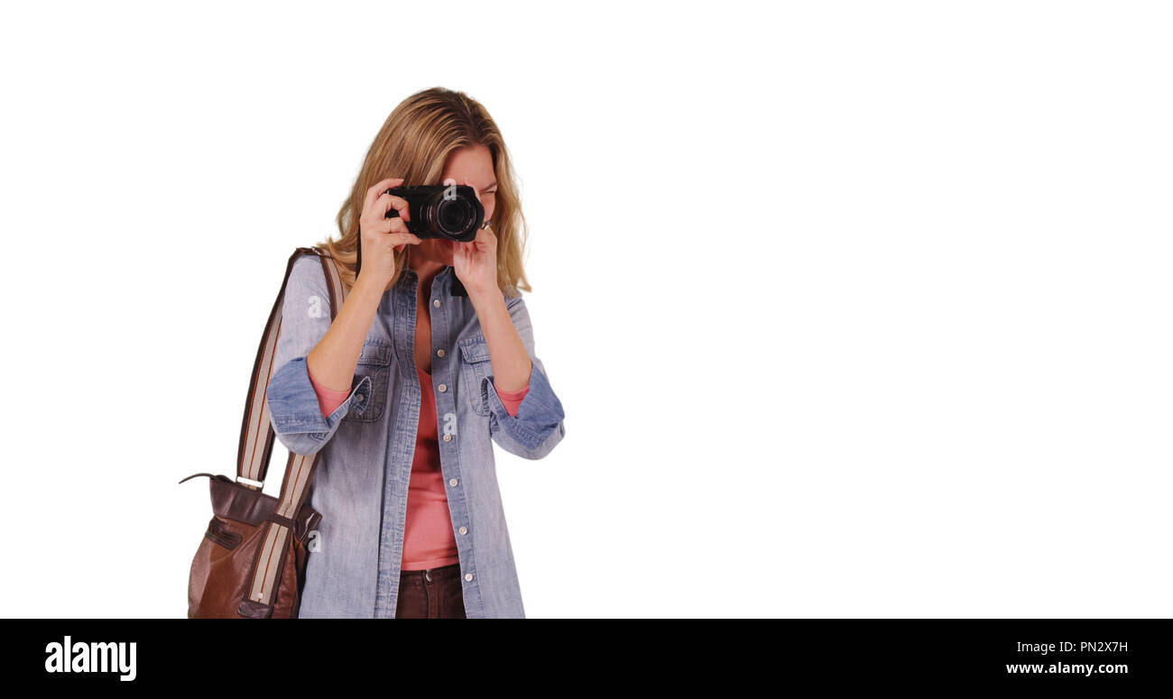 Gentile turista femminile o fotografo di scattare una foto della persona Foto Stock