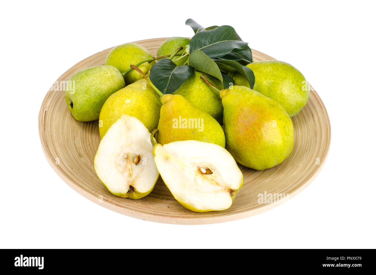 Mature pere dolci sul piatto di legno Foto Stock