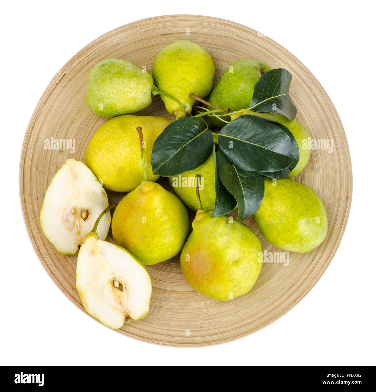 Mature pere dolci sul piatto di legno Foto Stock