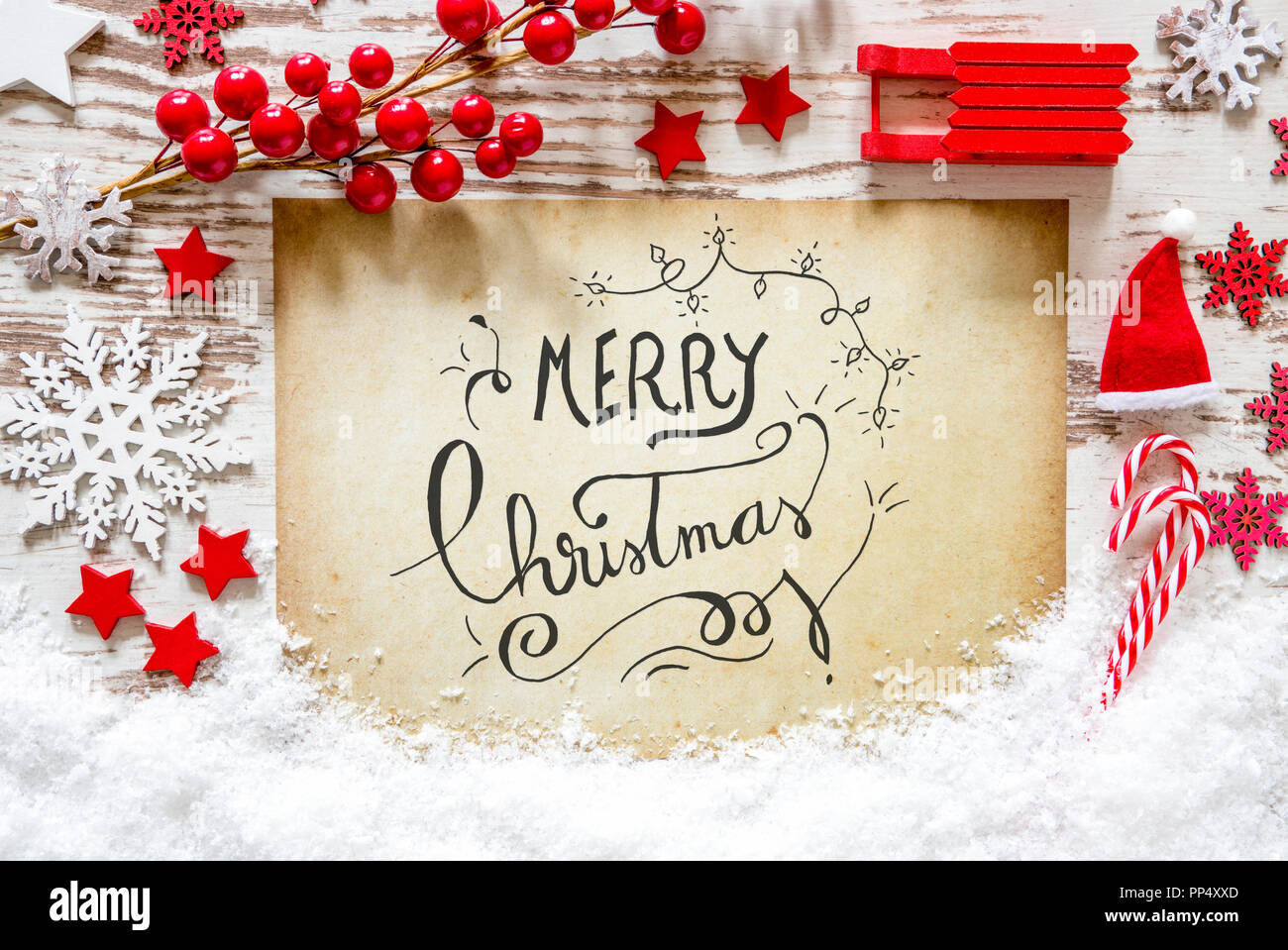 Rosso della decorazione, neve, Calligrafia testo Buon Natale Foto Stock
