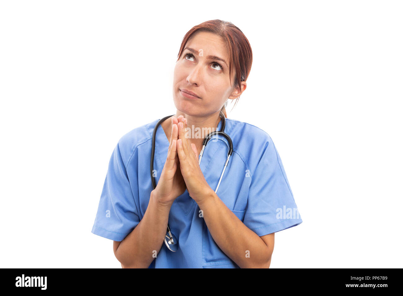 Donna religiosa infermiere o medico facendo pregare gesto come medical fede sperando dipendente ospedaliero concetto isolato su sfondo bianco Foto Stock