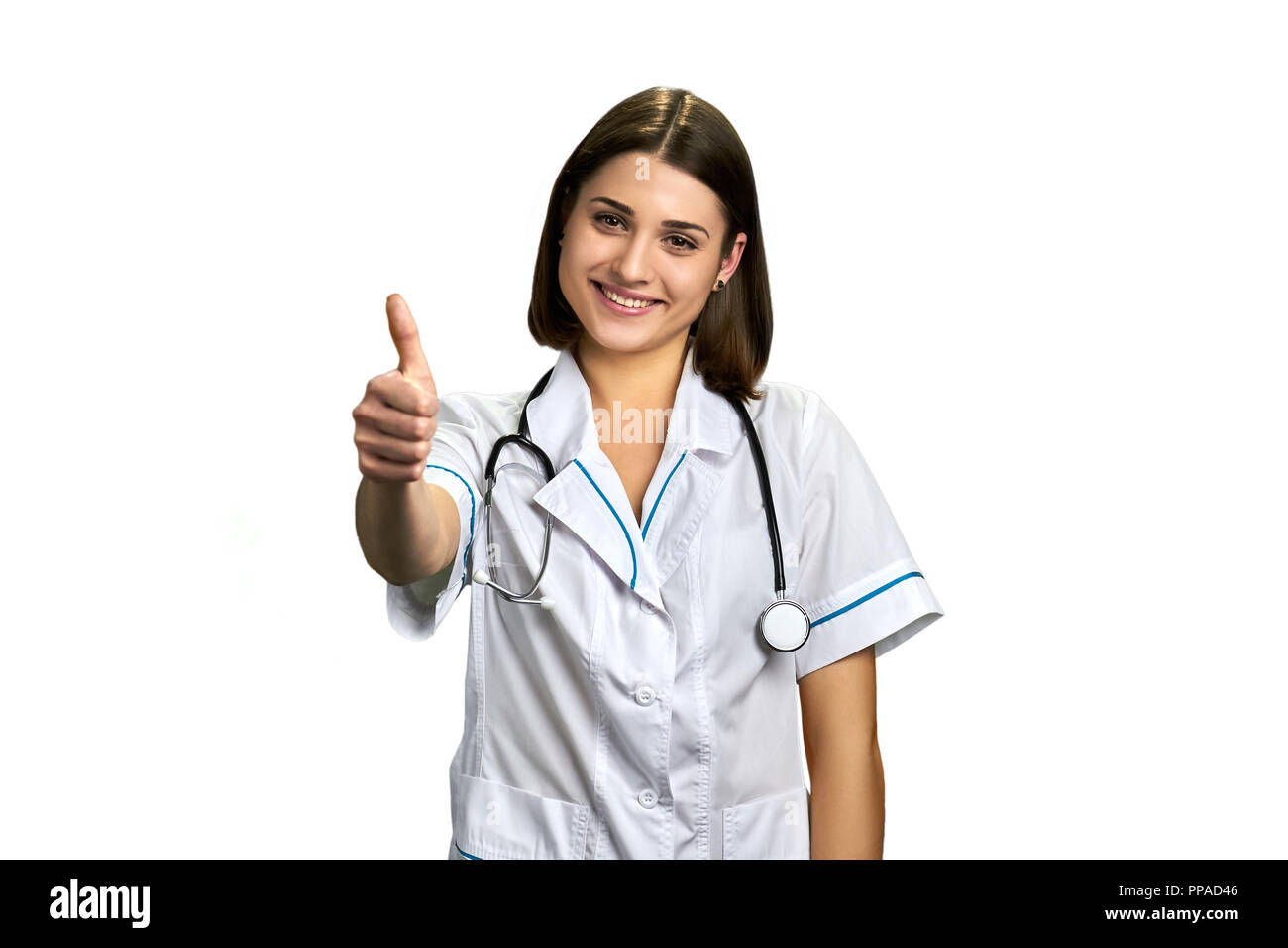 Donna dottore gesticolando pollice in alto. Foto Stock