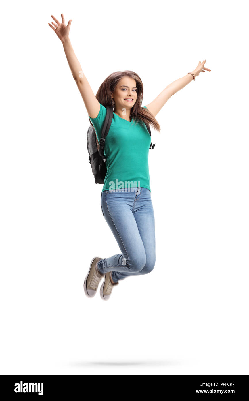 Lunghezza completa il ritratto di una studentessa con zaino jumping isolati su sfondo bianco Foto Stock