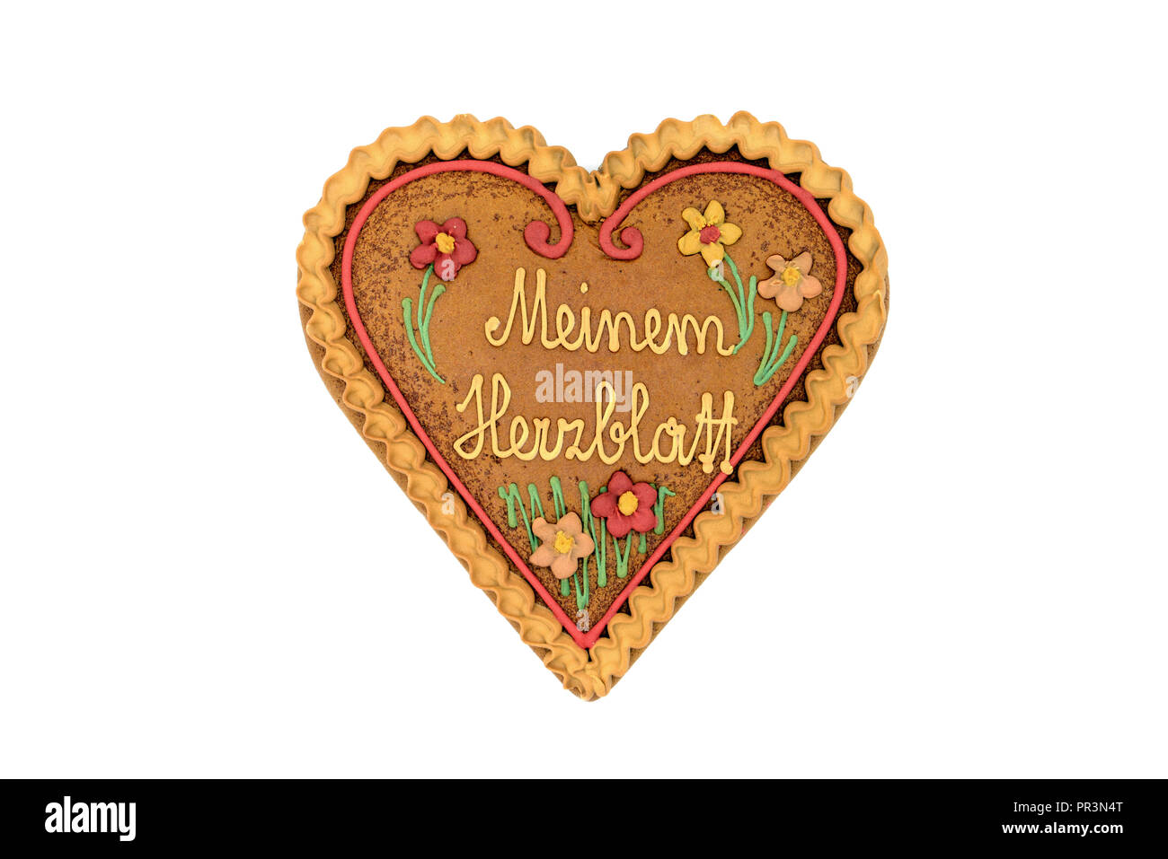 Gingerbread forma di cuore il giorno di san valentino regalo con parole tedesche Meinem Herzblatt ( ingl. il mio sweetheart) bianco su sfondo isolato. Foto Stock