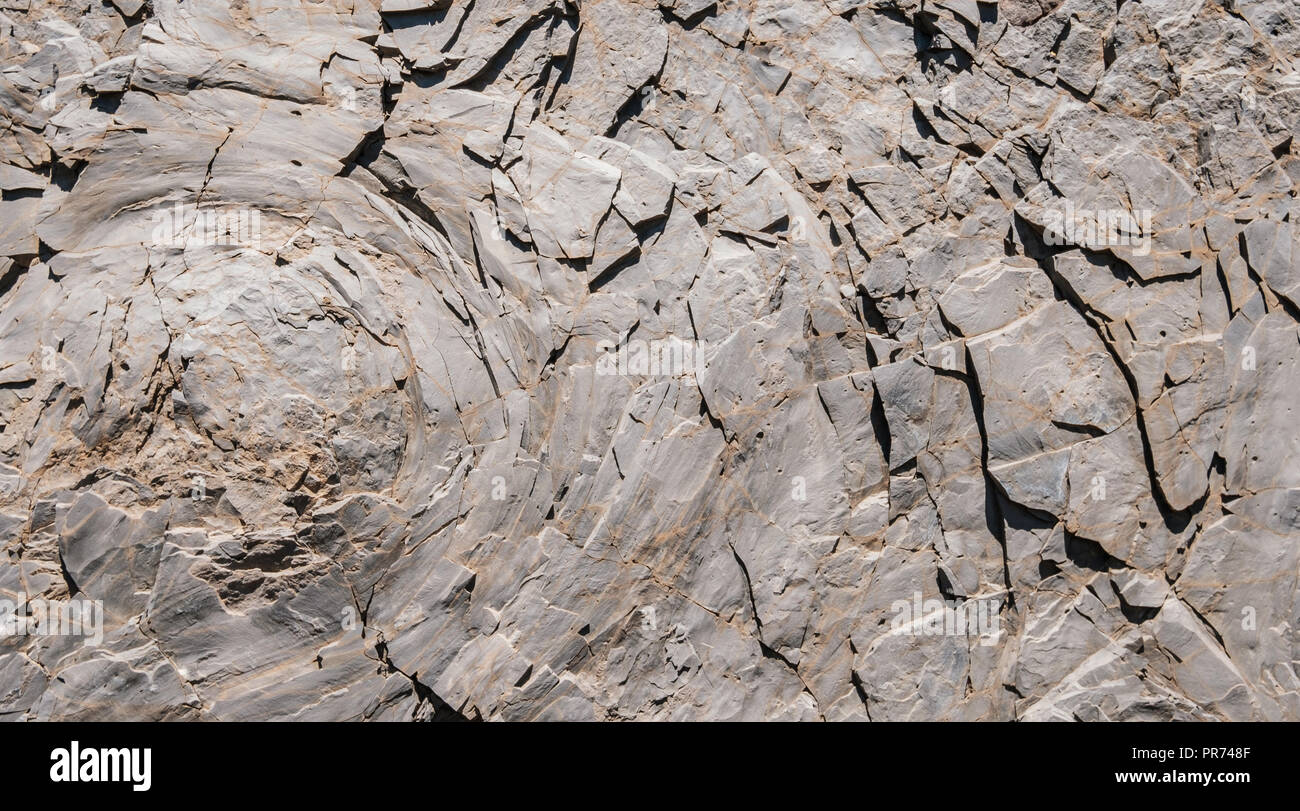 Rocce / rock background - texture in pietra con buccia di cipolla - resistenza agli agenti atmosferici Foto Stock