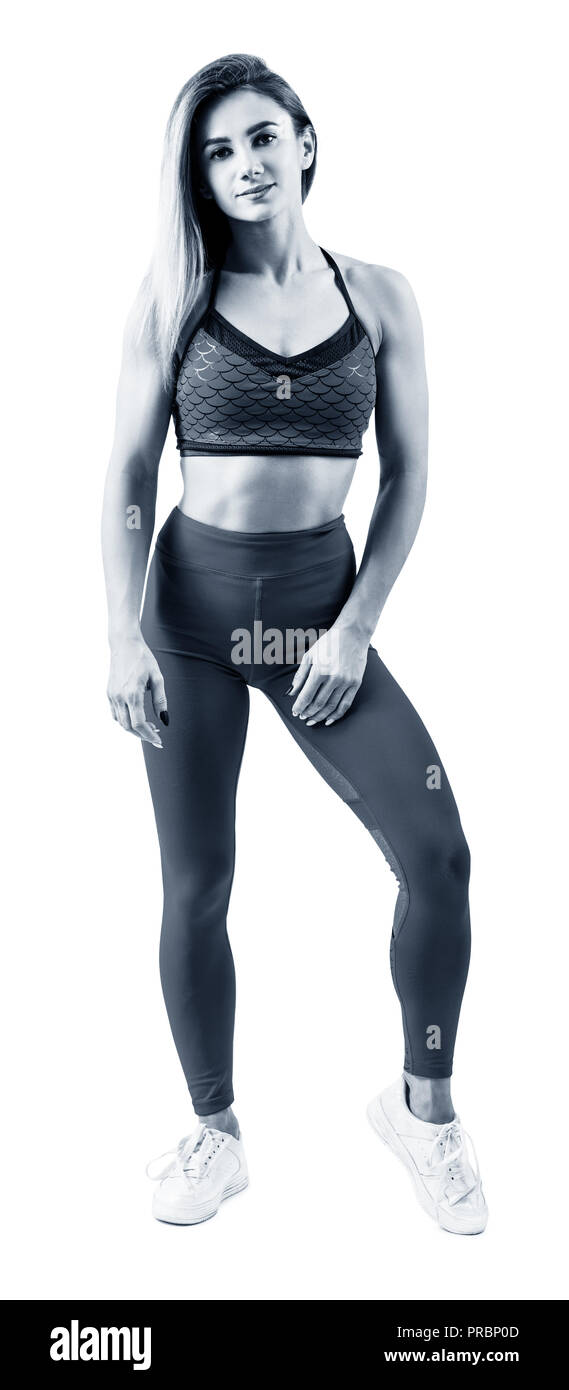 Lunghezza piena idoneità woman standing in abbigliamento sportivo. Foto Stock