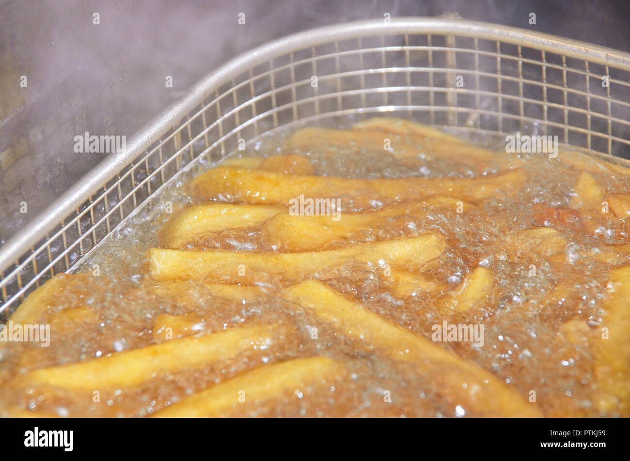 Frittieren von Pommes Foto Stock