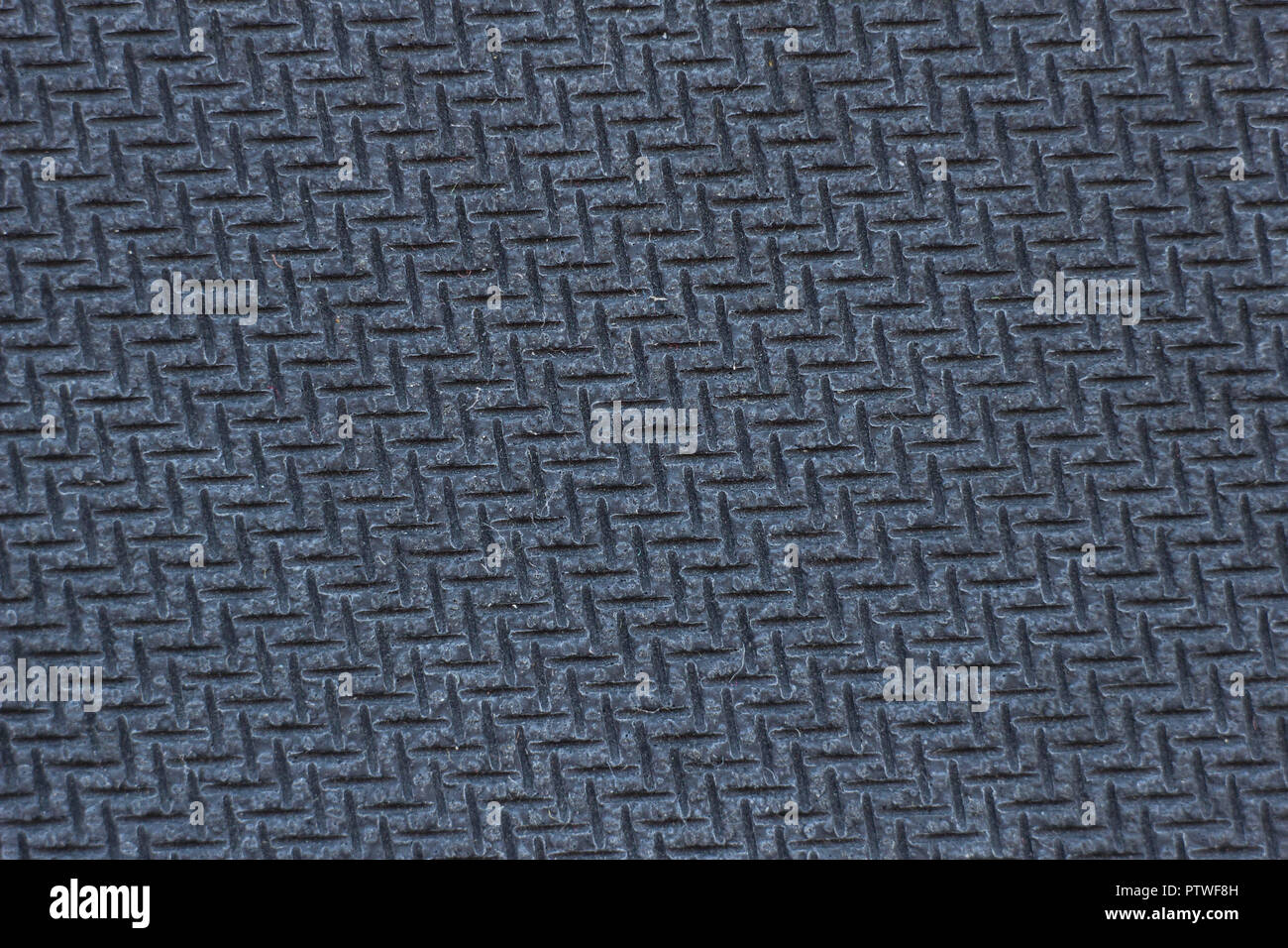 La consistenza di una gomma testurizzata tappetino per mouse di computer,  la fotografia macro, texture di gomma nero, nero Foto stock - Alamy