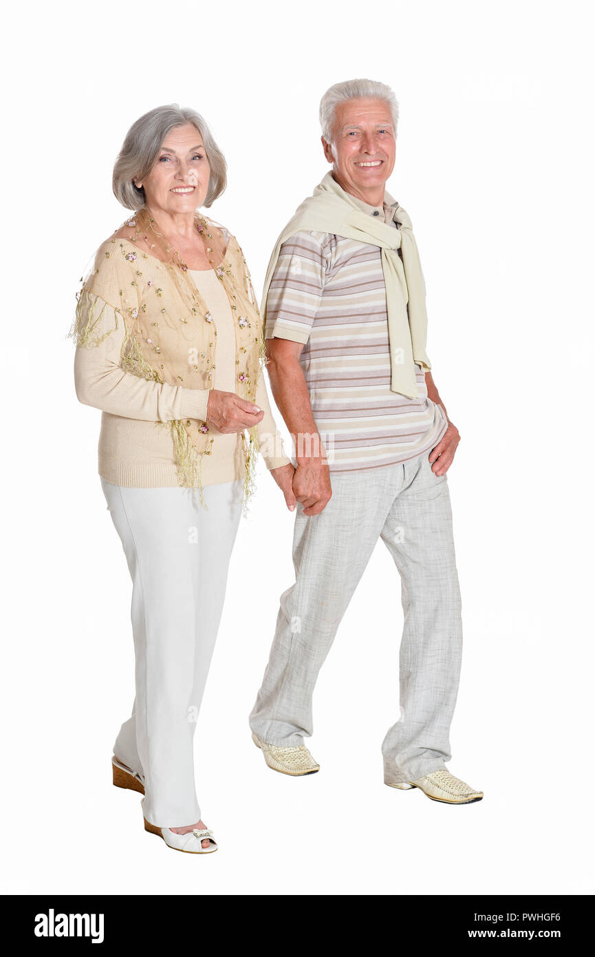 Ritratto di coppia senior tenendo le mani su sfondo bianco Foto Stock