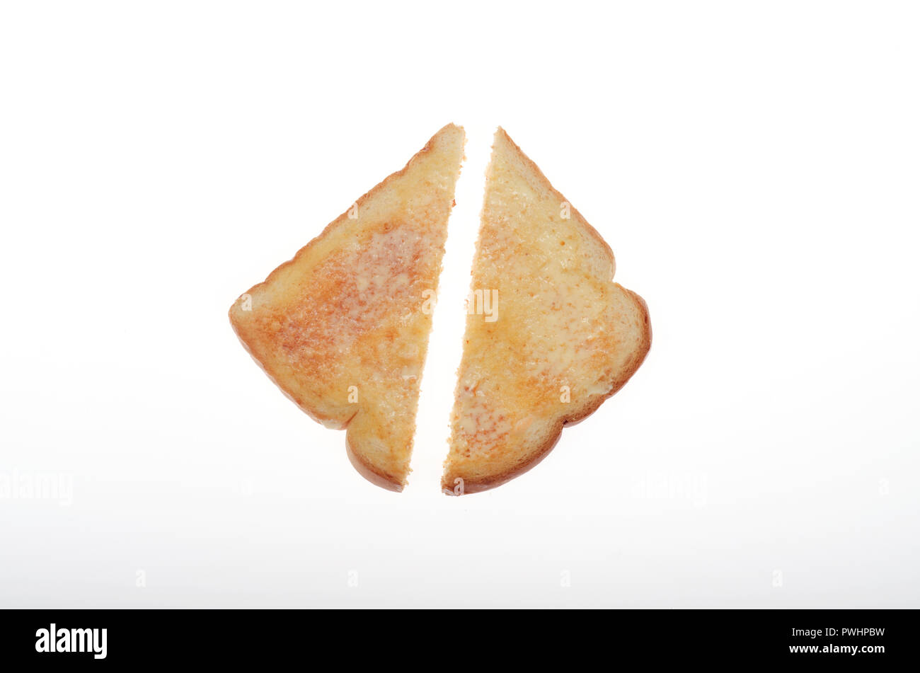 Imburrata caldi toast bianchi tagliati a metà Foto Stock