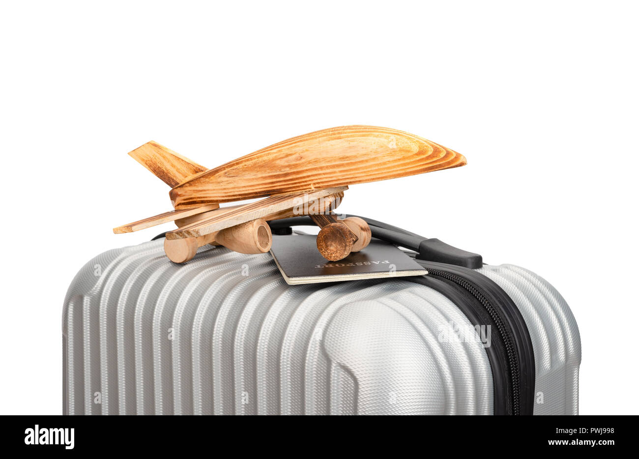 Modello di aereo e un passaporto sulla parte superiore di un bagaglio Foto Stock