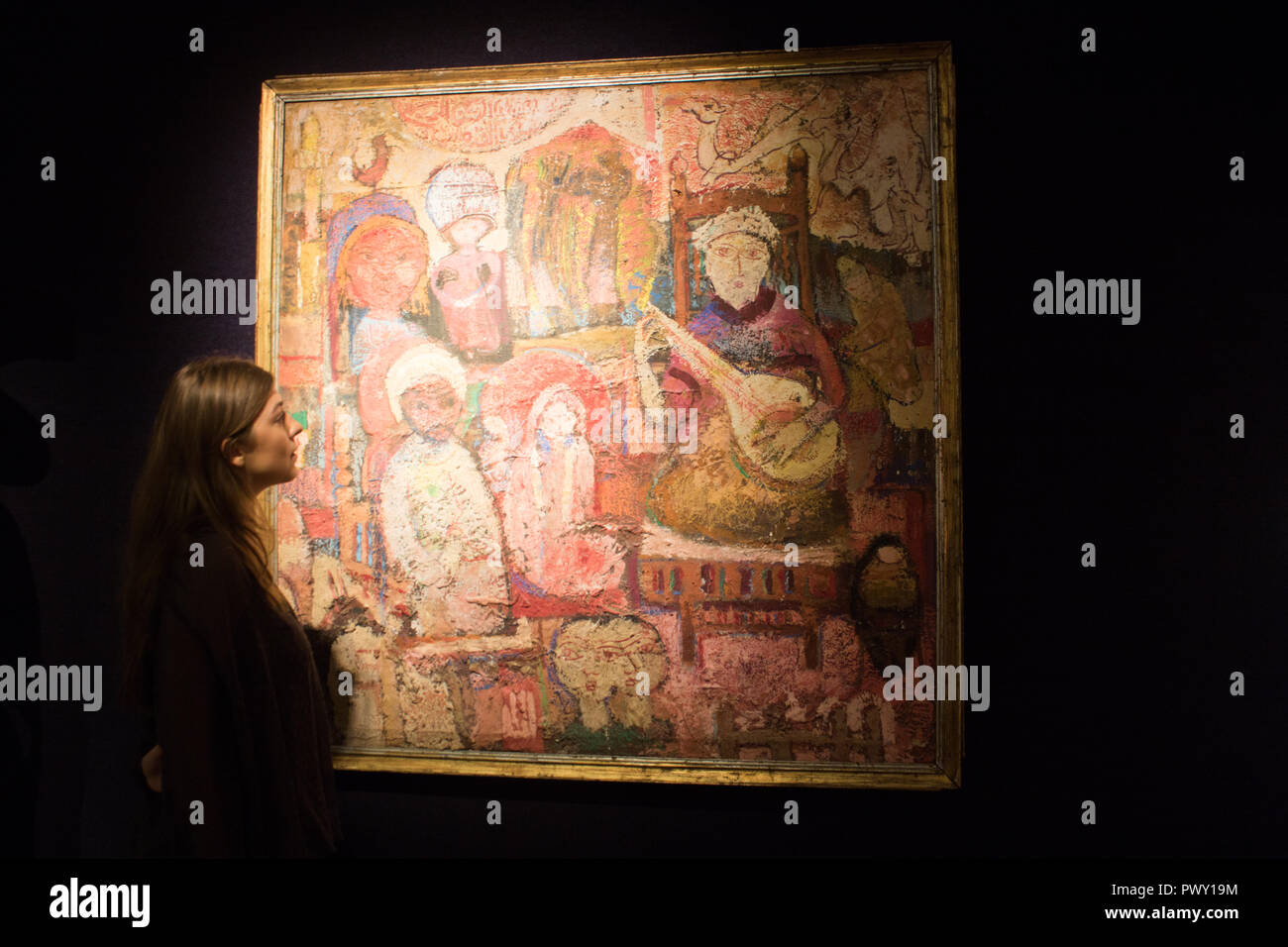 Londra REGNO UNITO. Il 18 ottobre 2018. Bonhams Anteprima di quella islamica e indiana, moderno e contemporaneo del Medio Oriente, di arte e di Arte Moderna e Contemporanea a sud di arte asiatica che la vendita avviene prima di arte asiatica settimana: Le Musicien des festeggiamenti tecnica mista su tela,Omar El Nagdi (Egitto) nato 1931£12,000-15,000 Credito: amer ghazzal/Alamy Live News Foto Stock