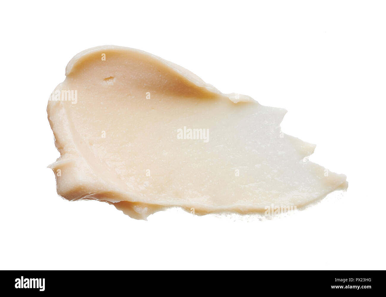 Delicatamente pennellate di colore beige e texture di correttore isolati su sfondo bianco Foto Stock