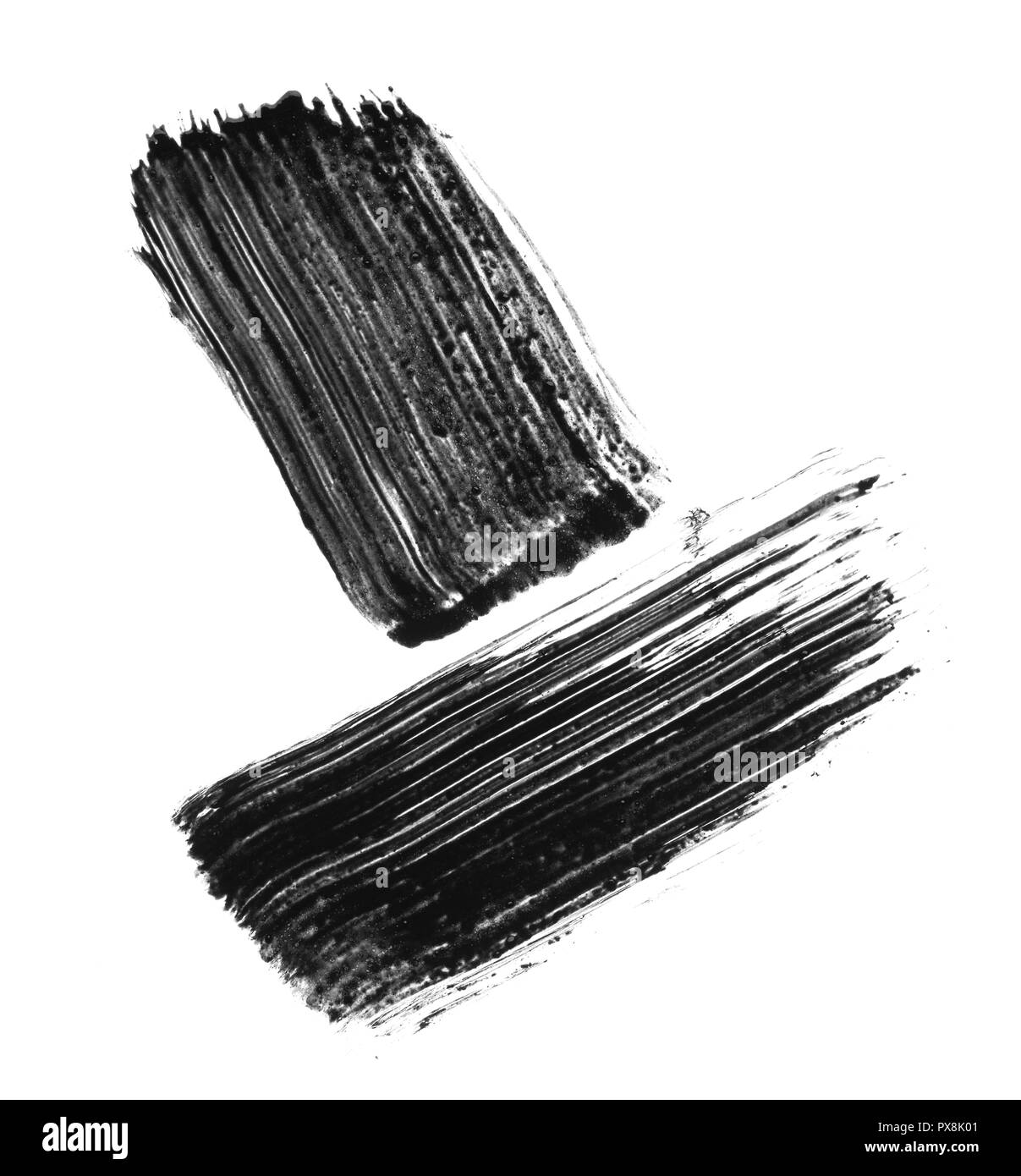 Texture di mascara nero per ciglia isolati su sfondo bianco. Cospargere di mascara nero per ciglia su sfondo bianco. Foto Stock