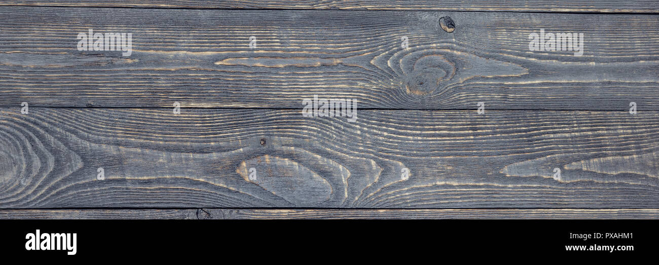 Sfondo scuro di texture in legno per le schede con i residui di vernice. Stretta. Foto Stock