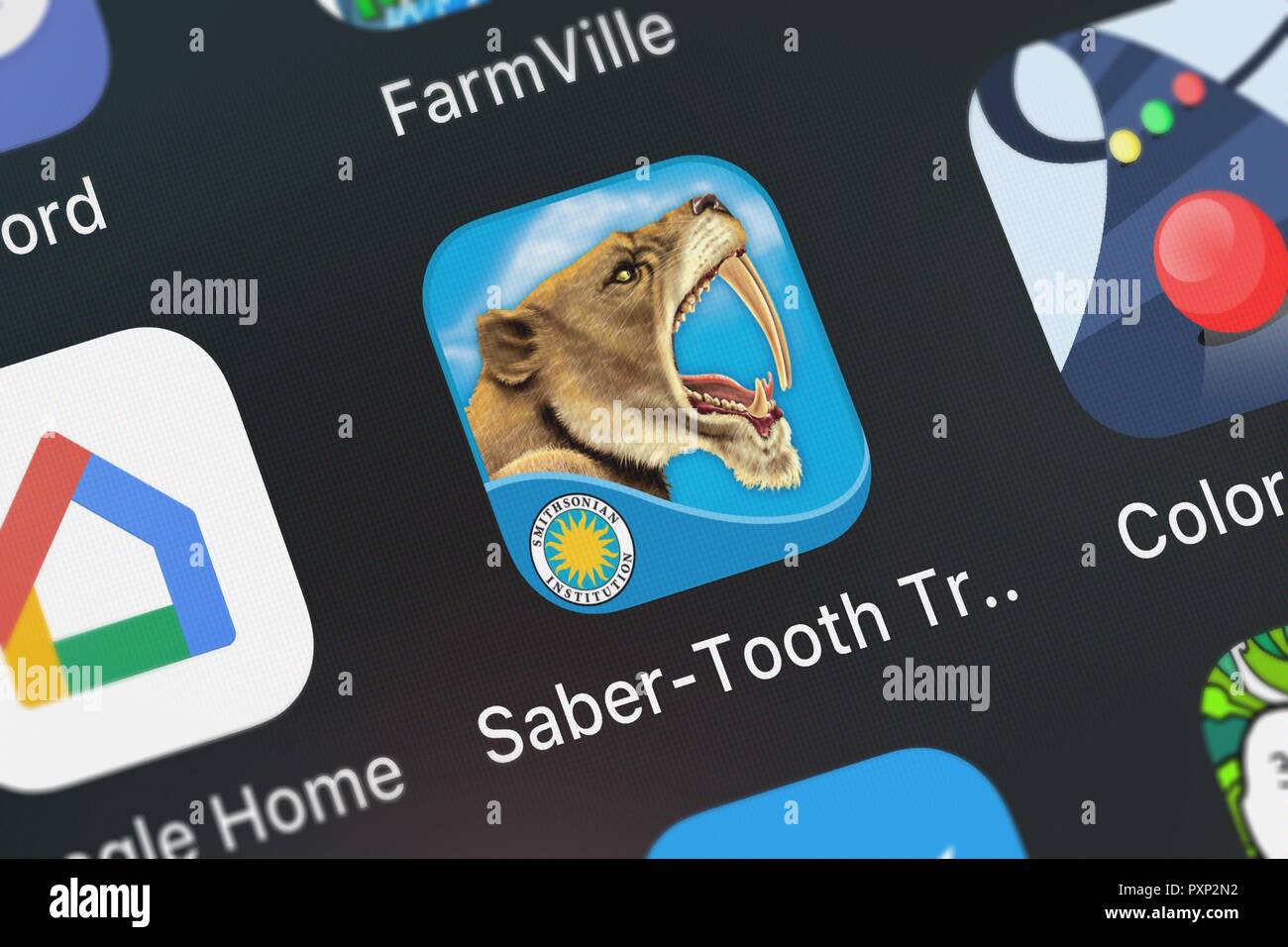 London, Regno Unito - 23 Ottobre 2018: screenshot del Saber-Tooth Trap - Smithsonian preistorica di Pals mobile app da Oceanhouse icona Media o Foto Stock