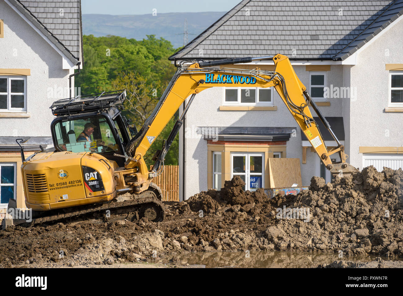 Costruzione e lavori di costruzione di un nuovo sviluppo di alloggiamento. Foto Stock