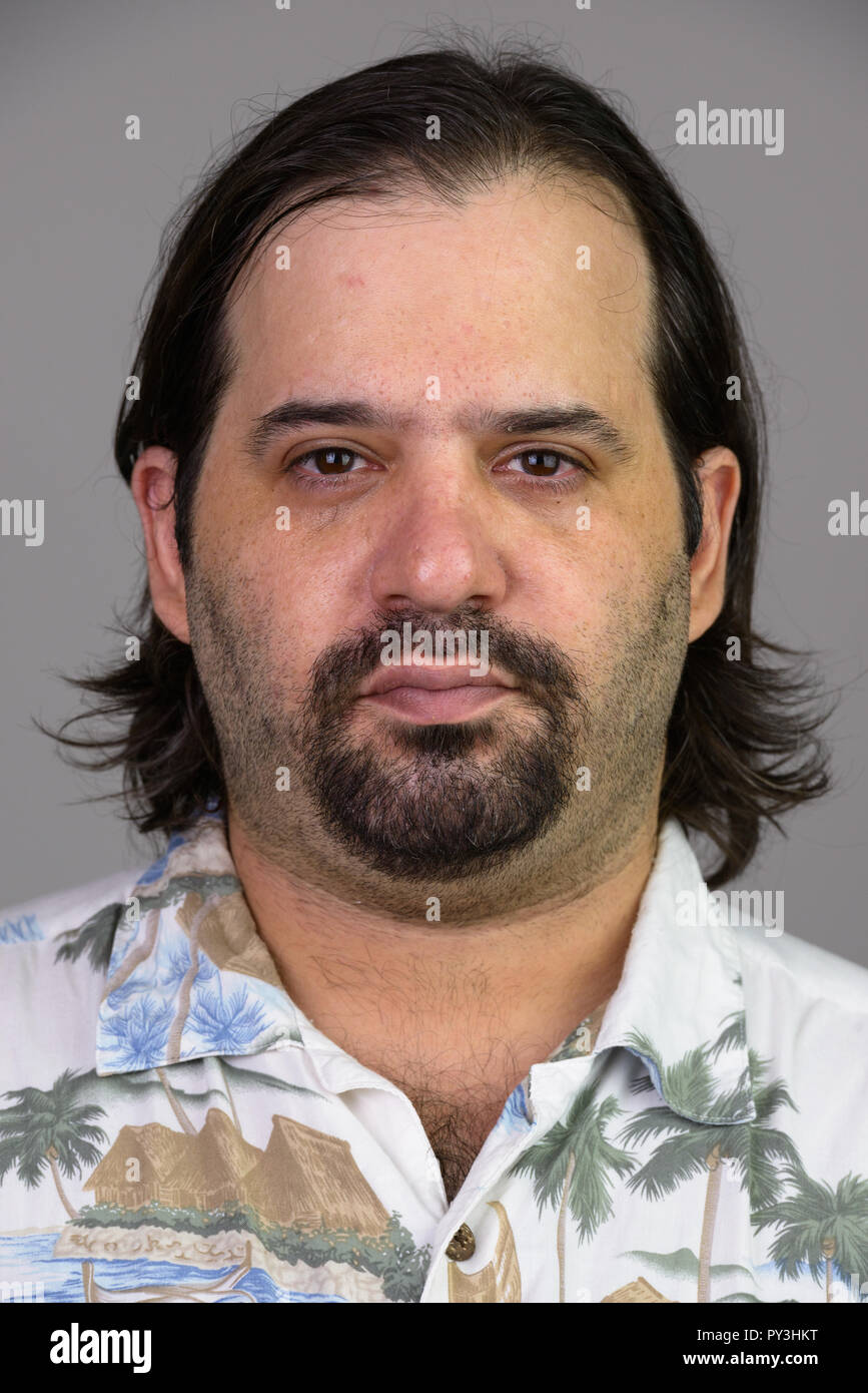 La faccia di grasso uomo caucasico in camicia hawaiana Foto Stock