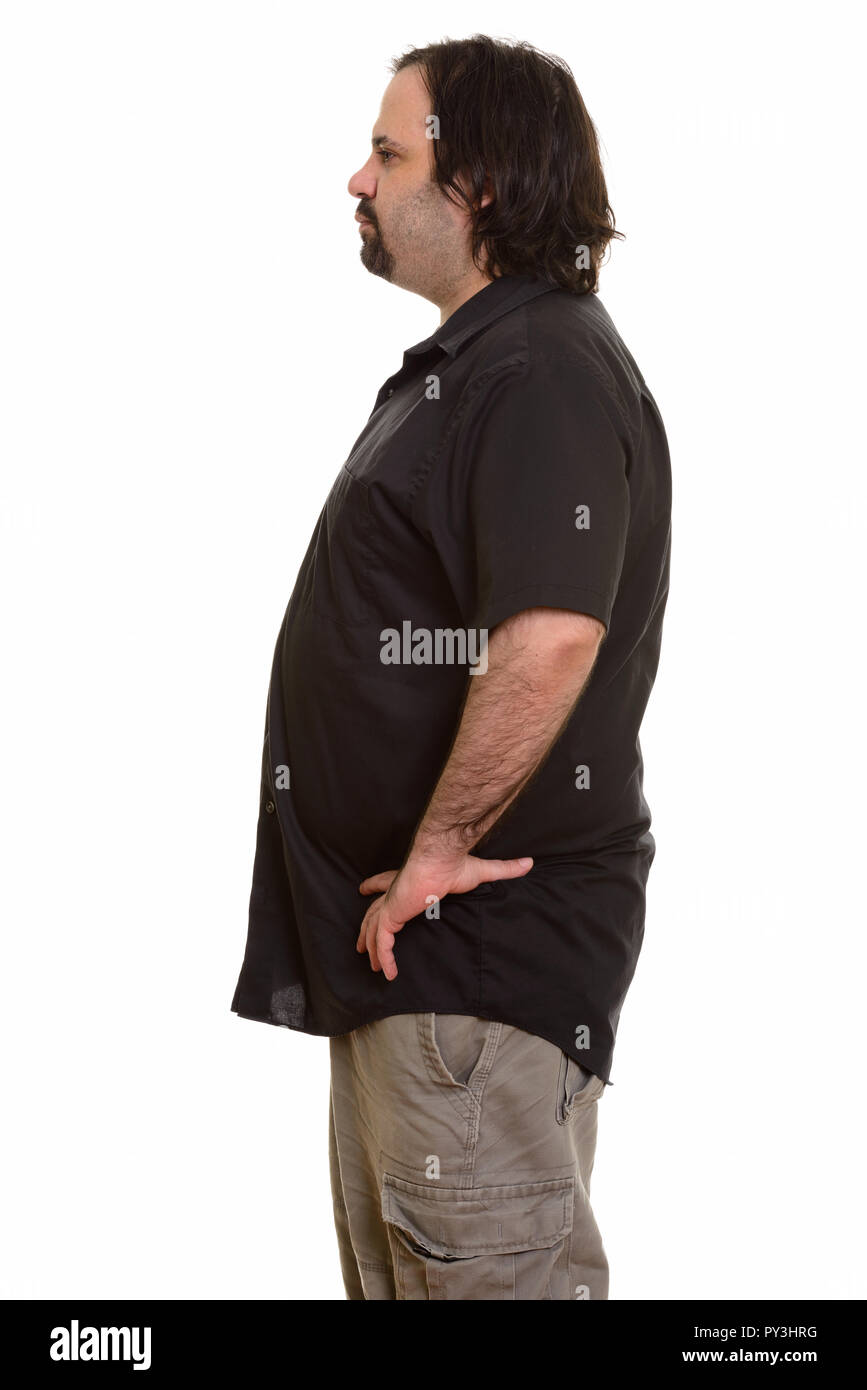 Vista di profilo di grasso uomo caucasico in piedi Foto Stock