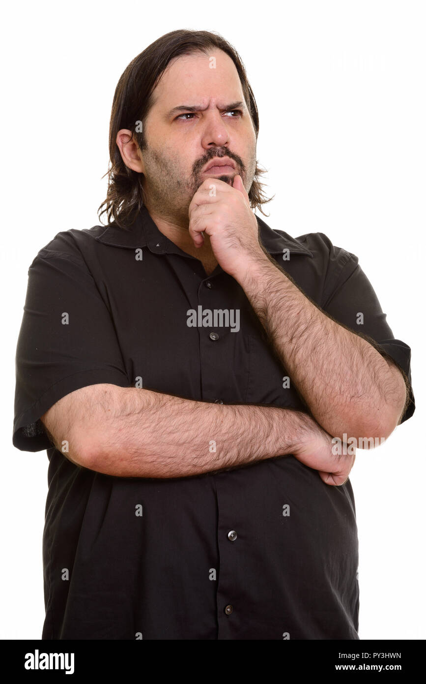 Fat uomo caucasico pensando con mano sul mento Foto Stock