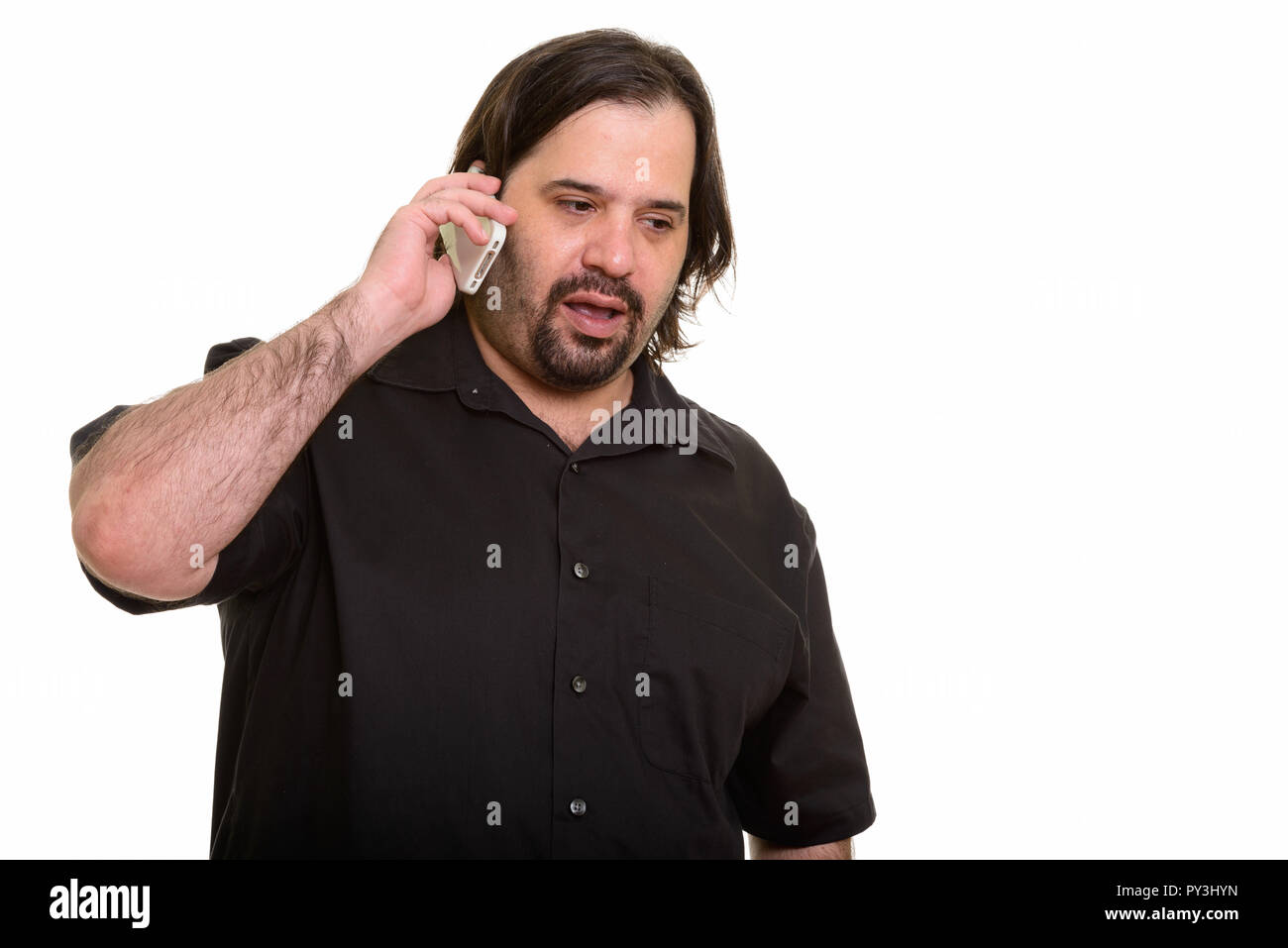 Fat uomo caucasico parlando al telefono cellulare Foto Stock