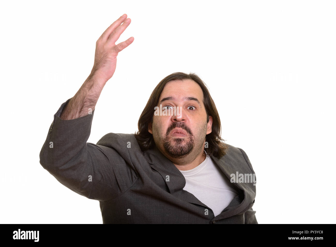 Ritratto di angry grasso imprenditore caucasico braccio di sollevamento Foto Stock