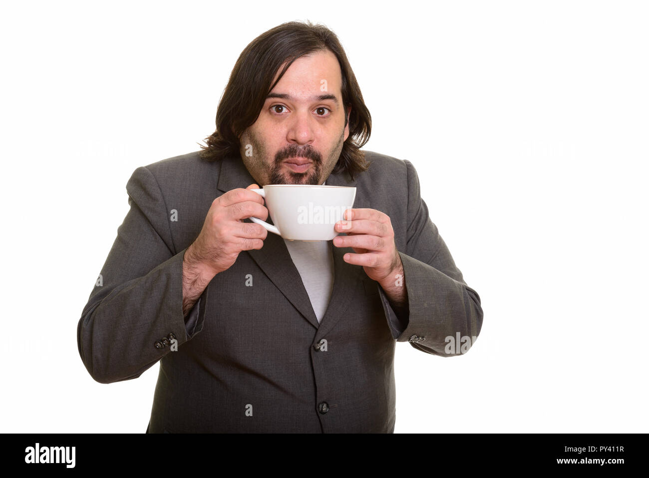 Ritratto di grasso imprenditore caucasico bere il caffè caldo Foto Stock
