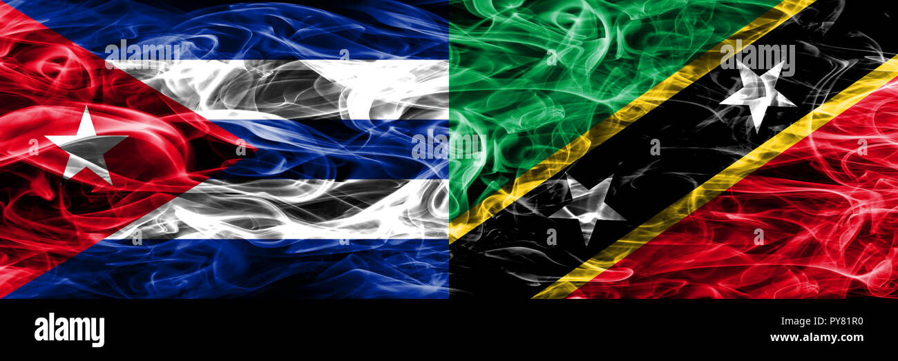 Cuba, cubana vs Saint Kitts e Nevis bandiere di fumo affiancati. Concetto e idea bandiere mix Foto Stock