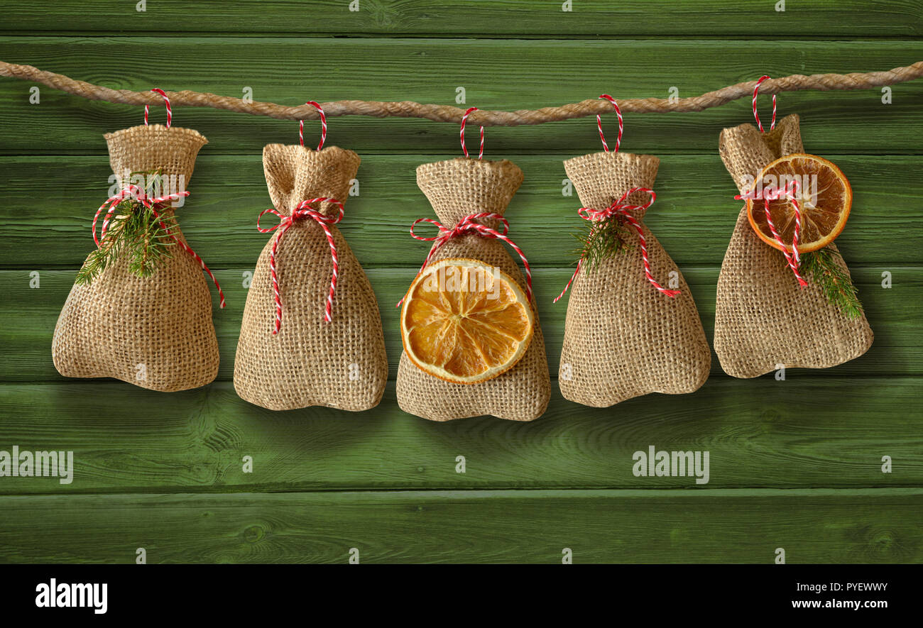 Scheda di Natale saluti di natale avvento sacco di iuta Foto Stock