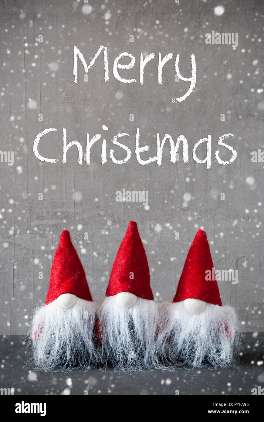 Tre gnomi rosso, cemento, i fiocchi di neve, Buon Natale Foto Stock