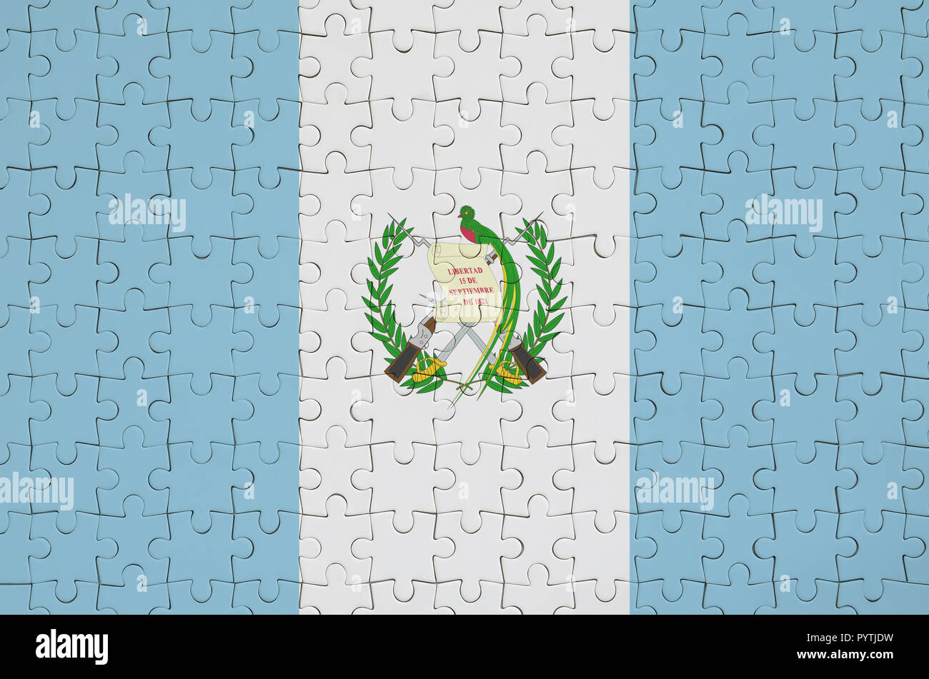 Bandiera del Guatemala è raffigurato su un puzzle piegato Foto Stock