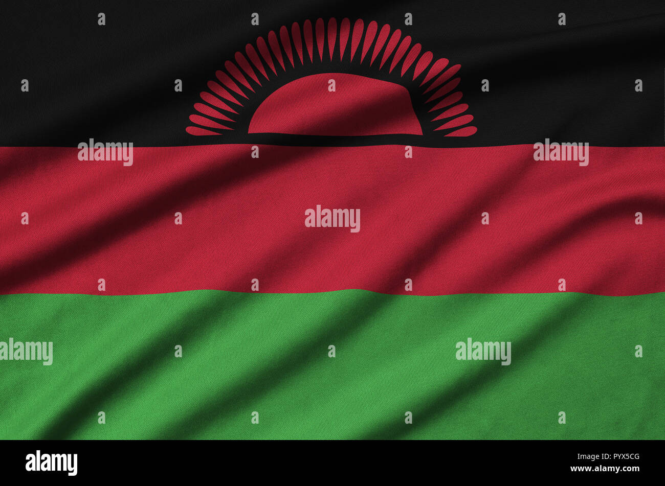 Il Malawi bandiera è raffigurato su un panno sport tessuto con molte pieghe. Sport team sventolando striscioni Foto Stock