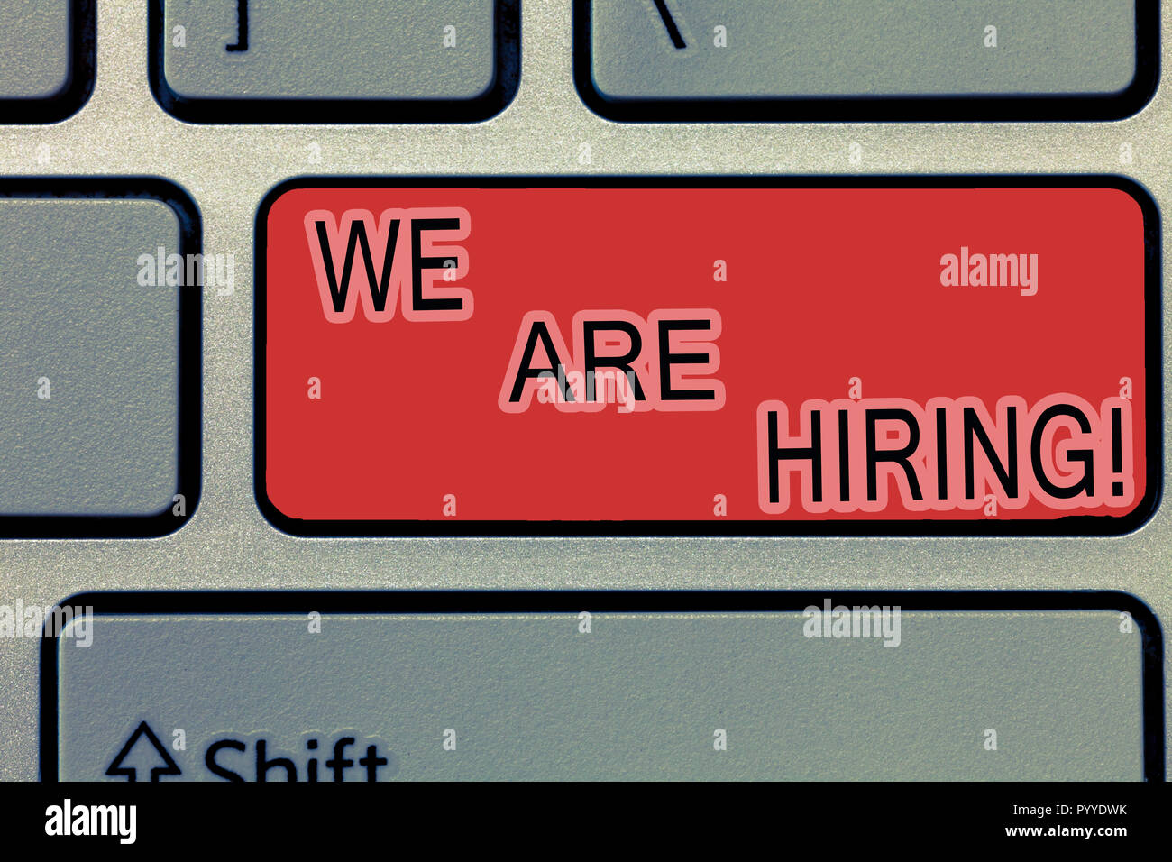 La grafia la scrittura di testo stiamo assumendo. Concetto significato pagare qualcuno per fare un lavoro particolare per la società in futuro. Foto Stock