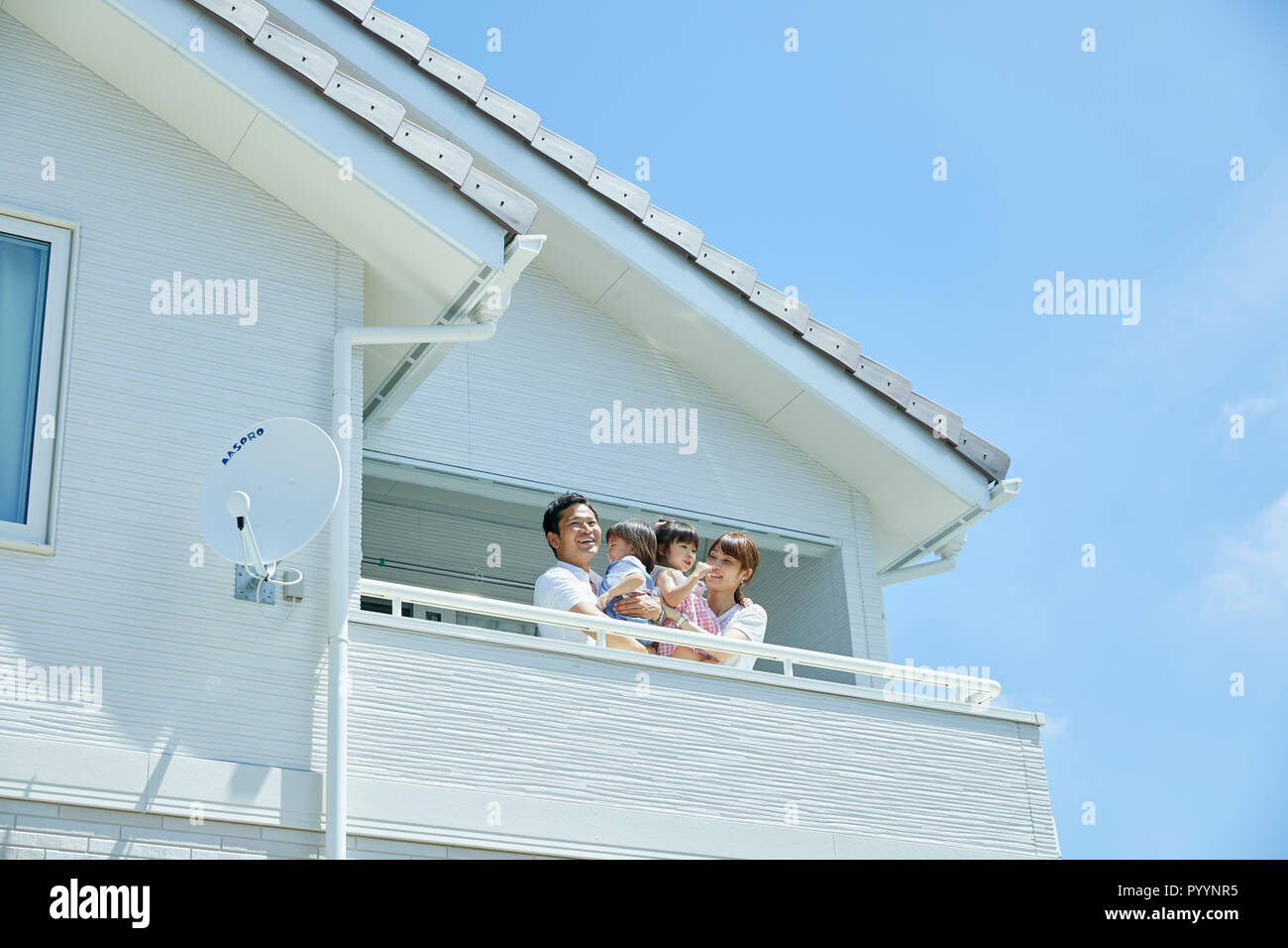 Famiglia giapponese a casa Foto Stock