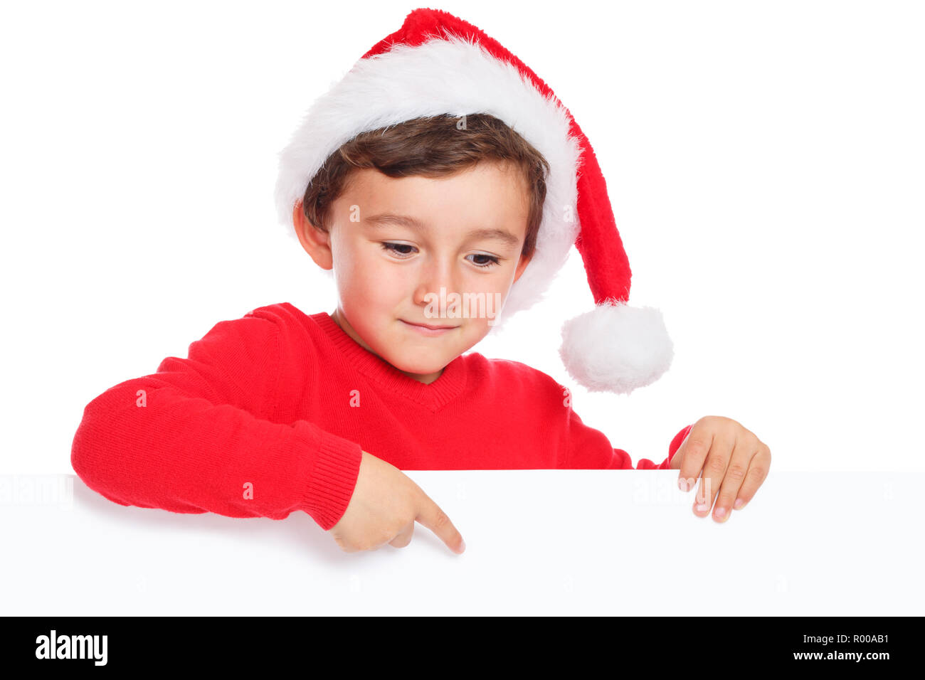 Bambino kid boy Christmas Santa Claus puntamento banner vuoto copyspace isolato di spazio di copia Foto Stock