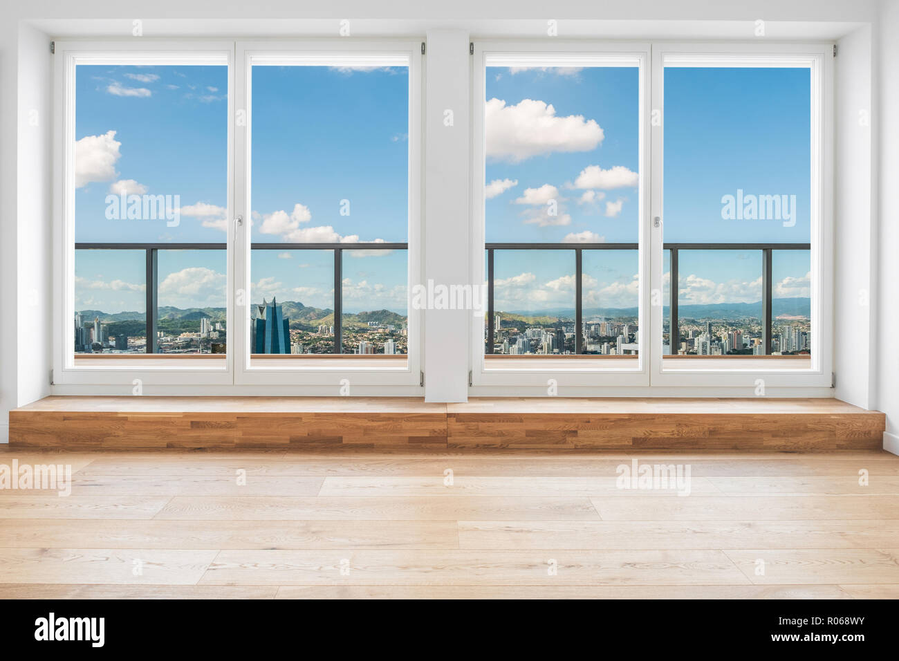 All'interno moderno appartamento penthouse camera con vista sulla skyline attraverso la finestra Foto Stock