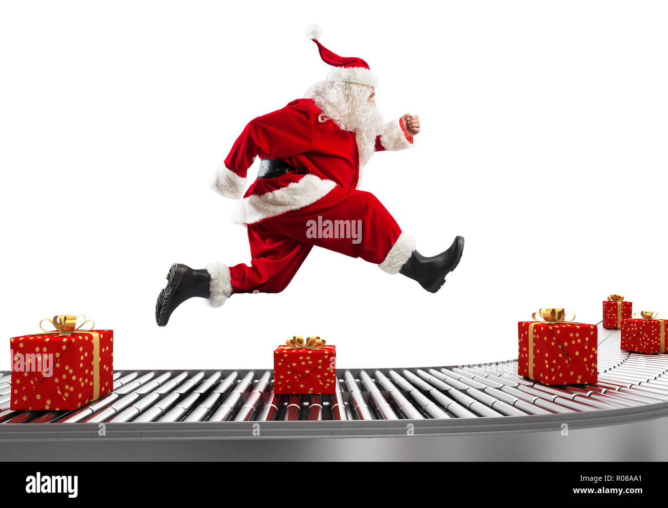 Babbo Natale corre sul nastro trasportatore per organizzare le consegne al tempo di Natale Foto Stock