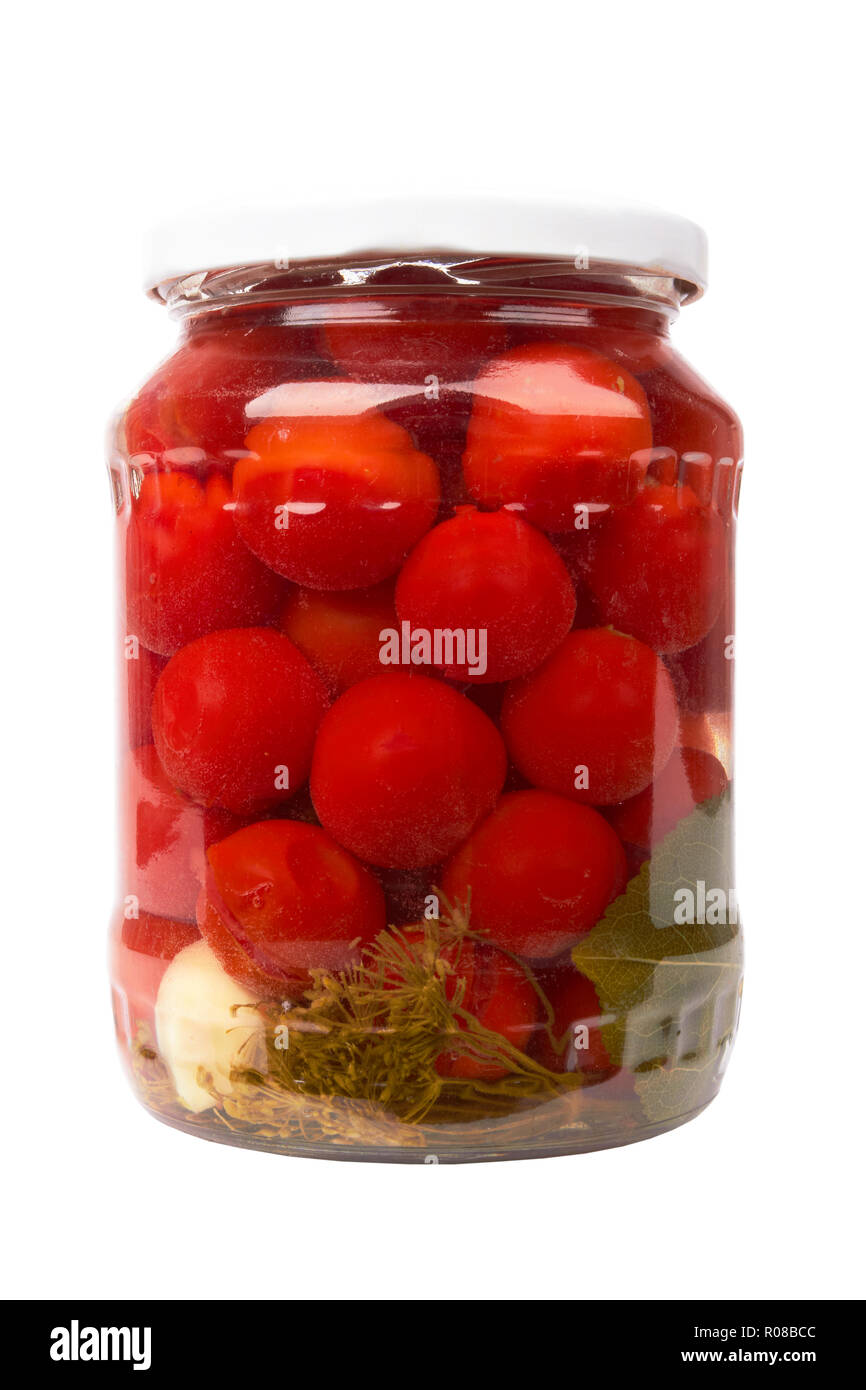 Vasetto di pomodori in scatola isolata su bianco Foto Stock