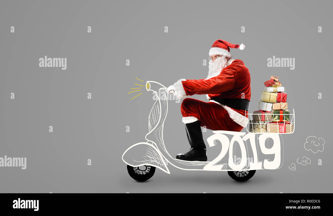 Babbo Natale su scooter Foto Stock