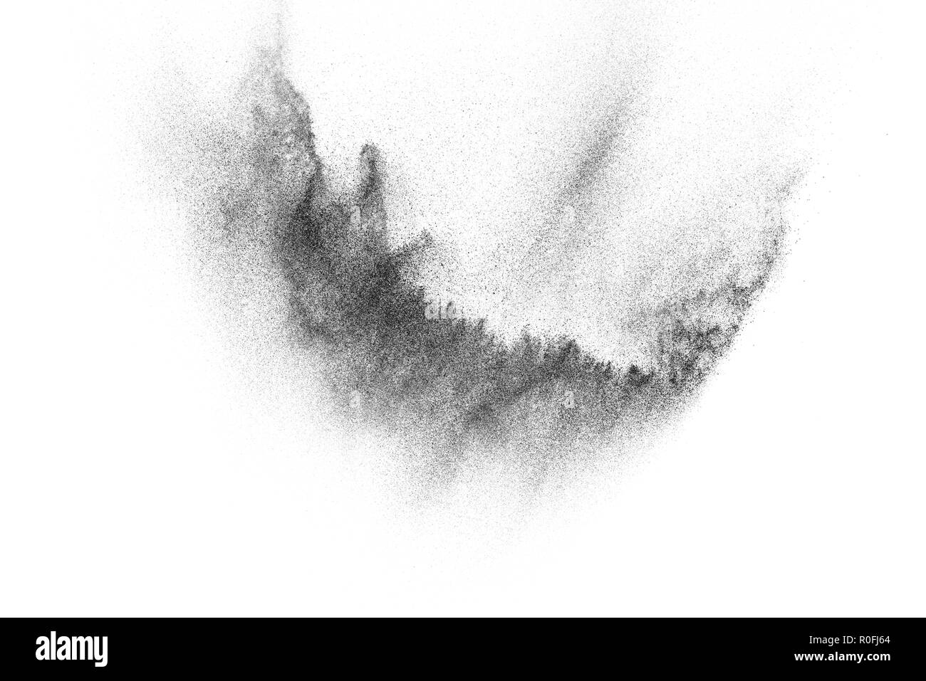 Le particelle di nero di esplosione isolati su sfondo bianco. Abstract mascherina antipolvere texture. Foto Stock