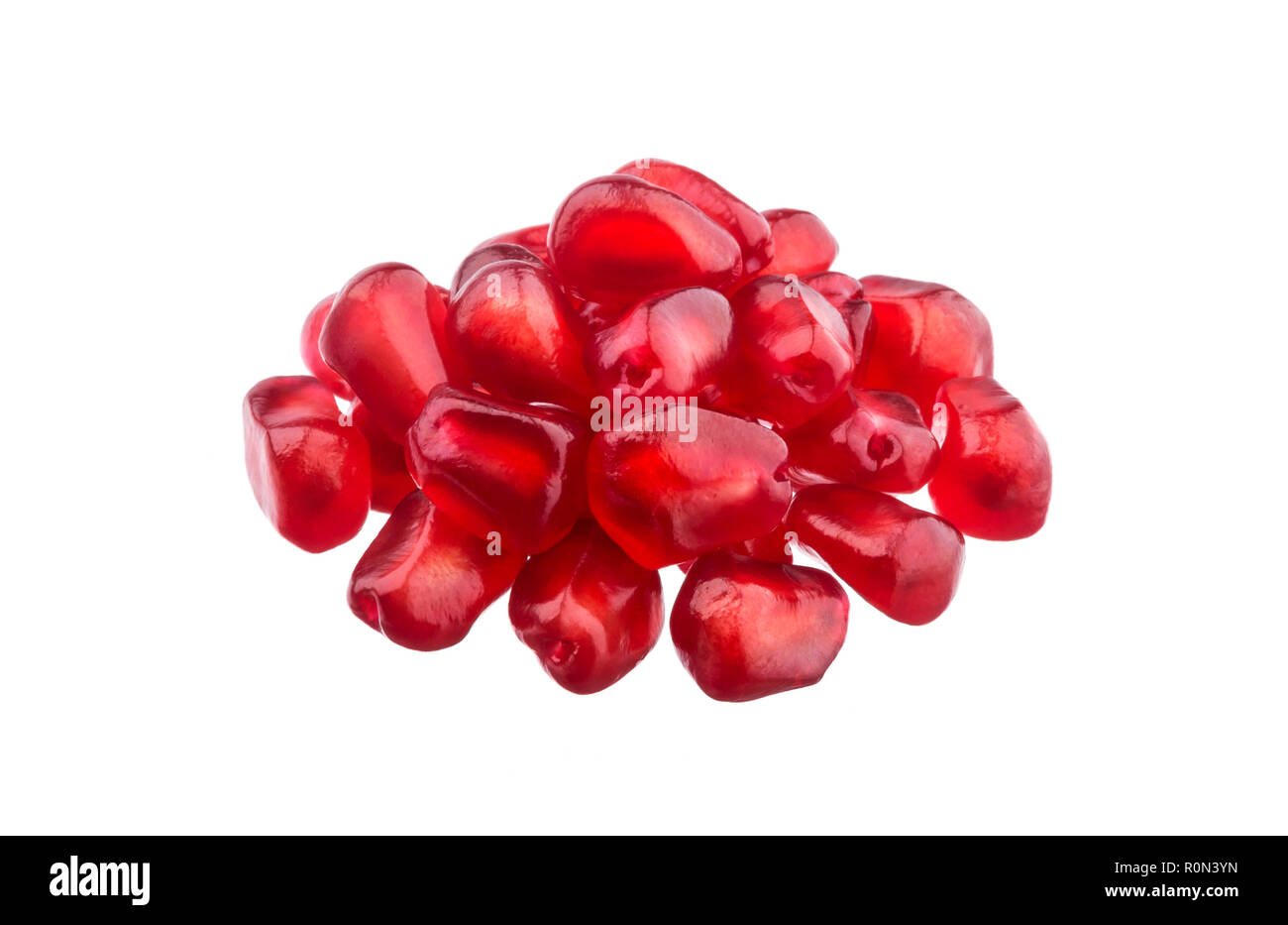 I semi di melograno isolati su sfondo bianco Foto Stock