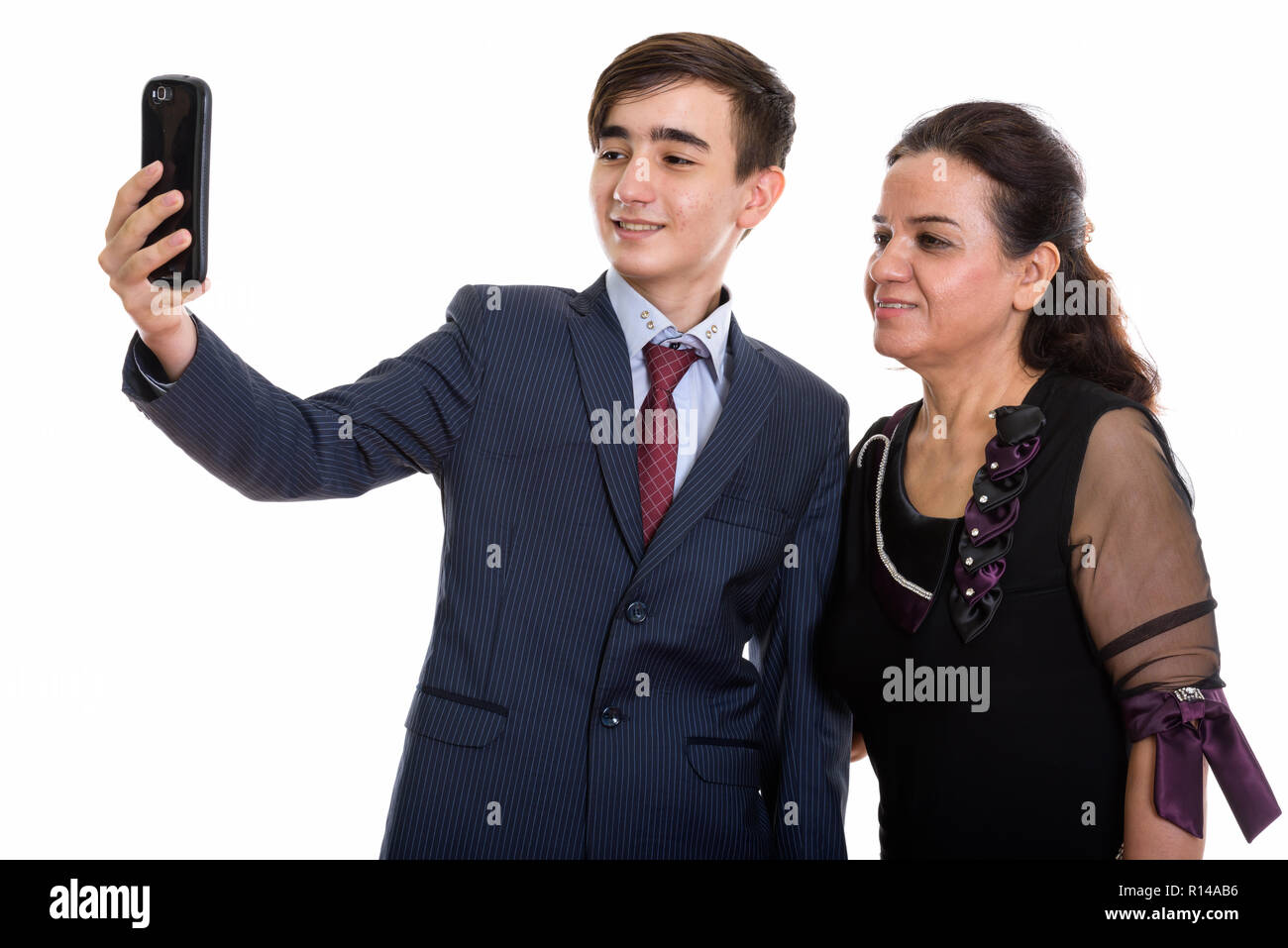 Studio shot di felice persiano giovane imprenditore adolescente e matur Foto Stock