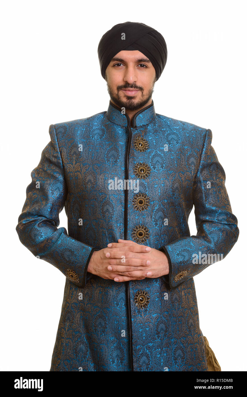 Giovani indiani bello Sikh dita intrecciate insieme indossando Foto Stock