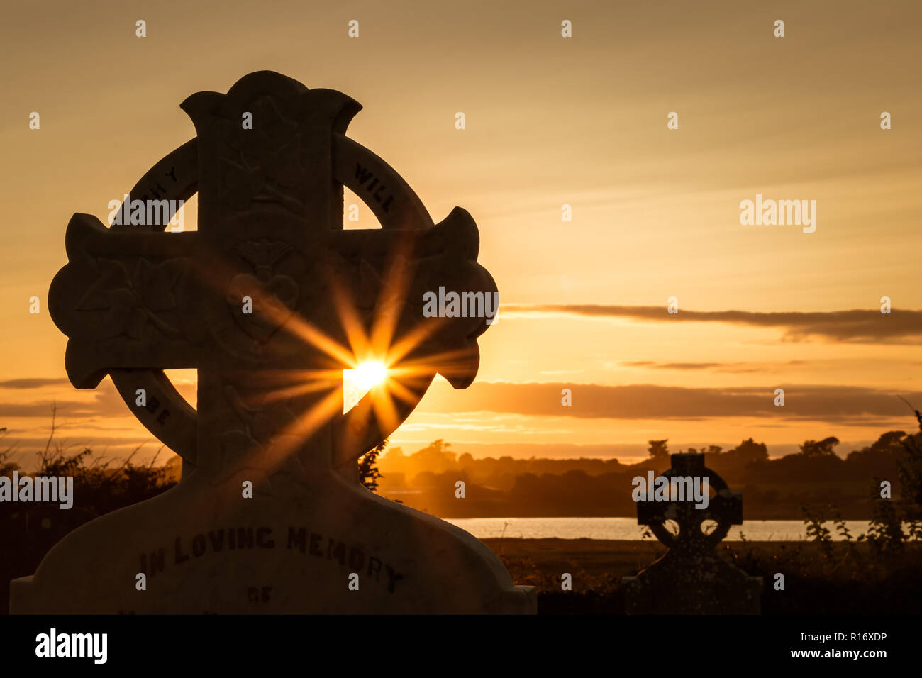 Lady's Island - Croce celtica al tramonto. Foto Stock