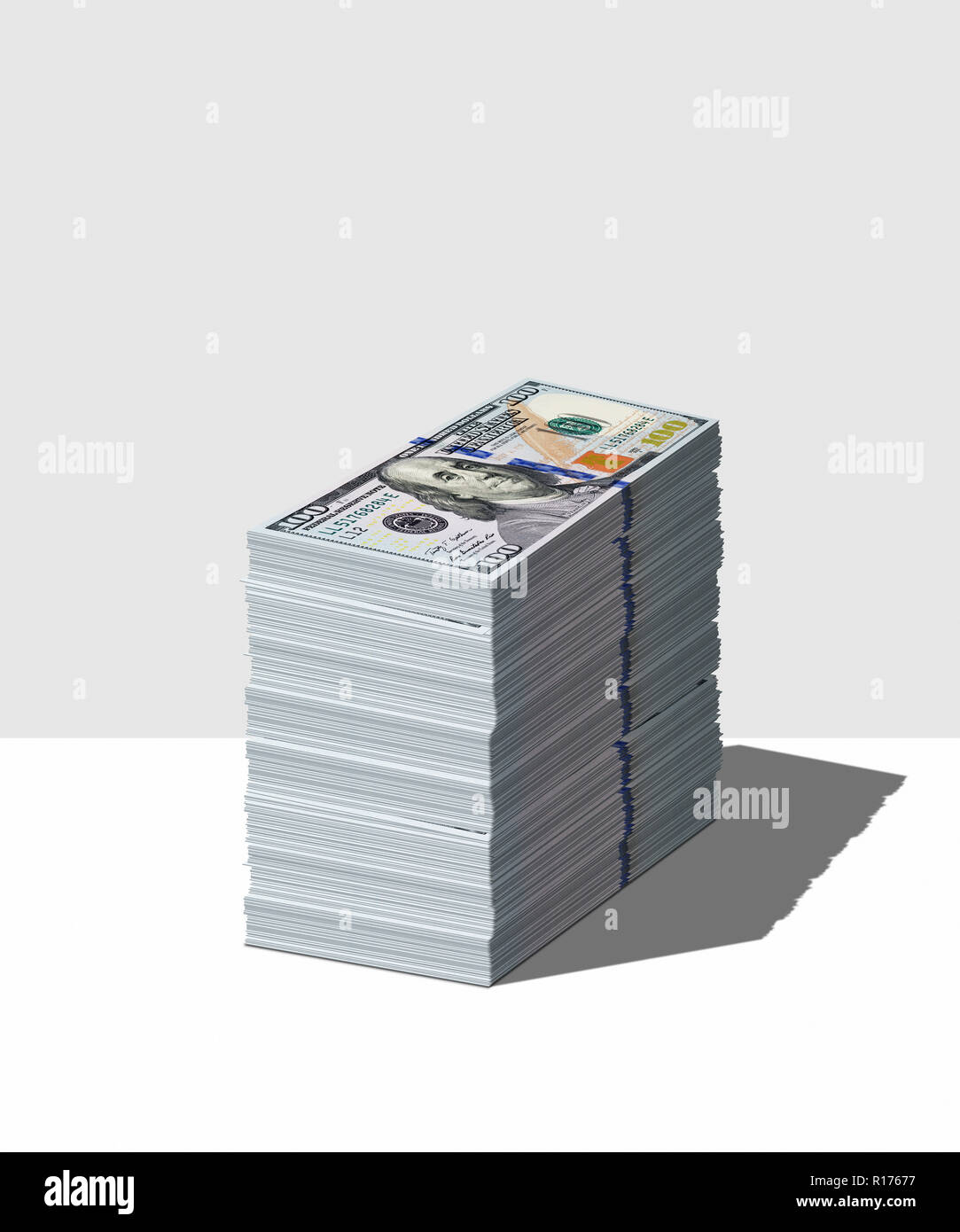 Pila di inutilizzati dollaro americano note, lo sfondo grigio Foto Stock