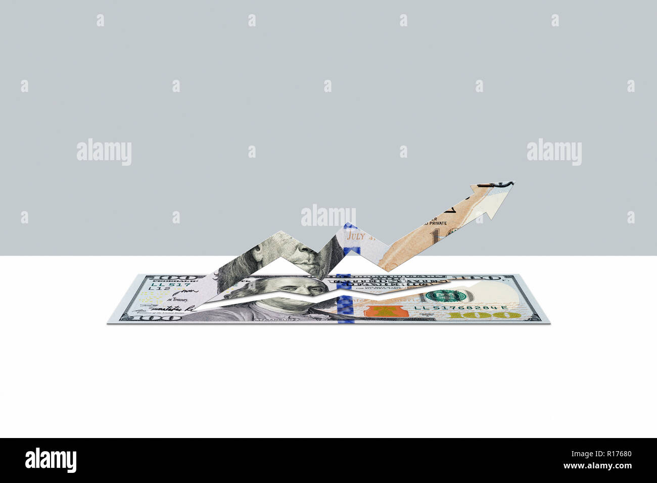 100 US dollar nota in forma di freccia in alto Foto Stock