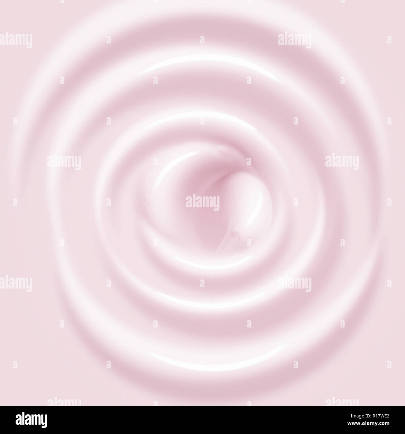 Vista ravvicinata di rosa pallido crema idratante in configurazione circolare, frame completo Foto Stock