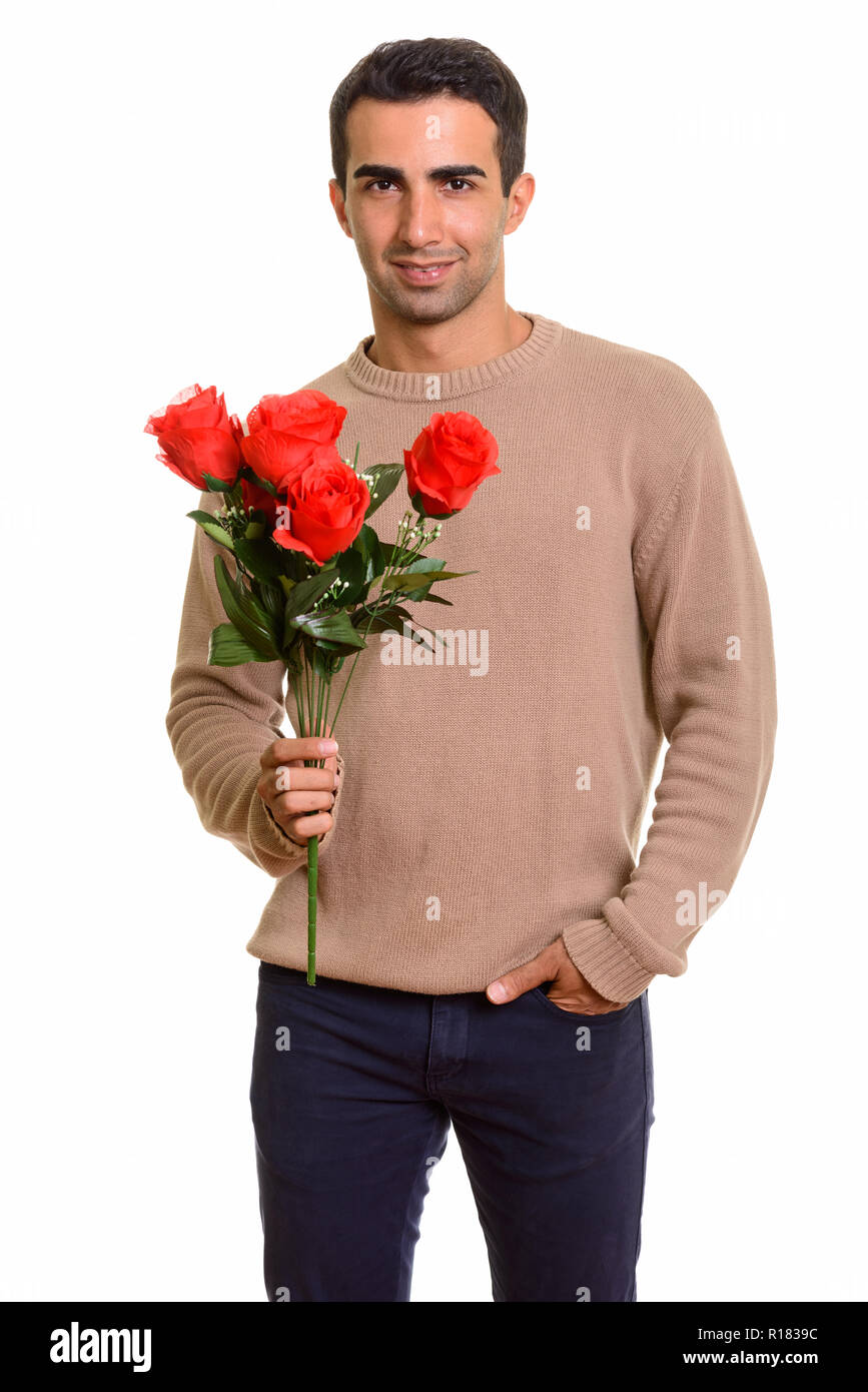 Ritratto di giovane bello persiano di uomo con fiori Foto Stock