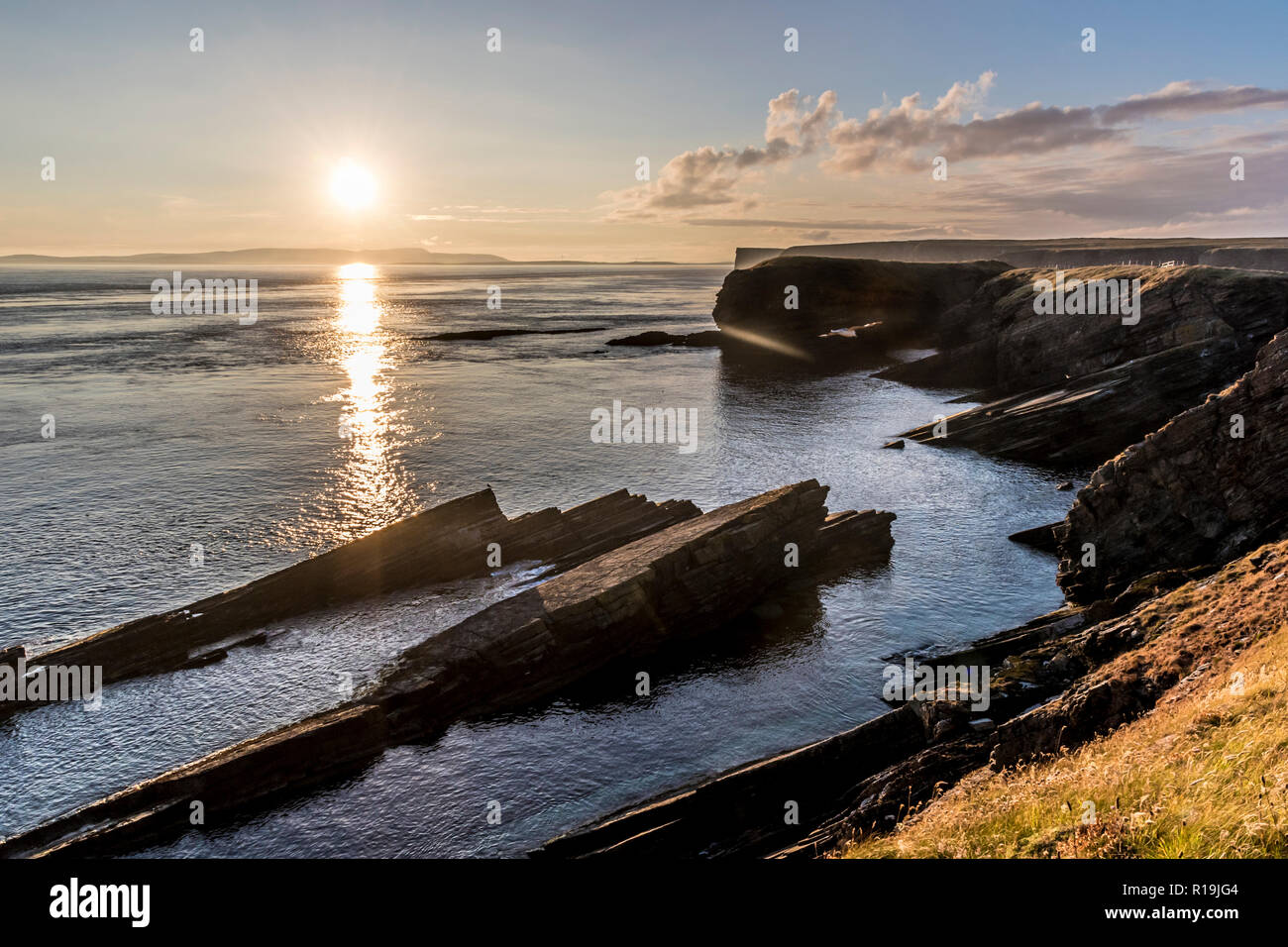 Tramonto dalla scogliera a piedi alla testa Burwick, South Ronaldsay Foto Stock