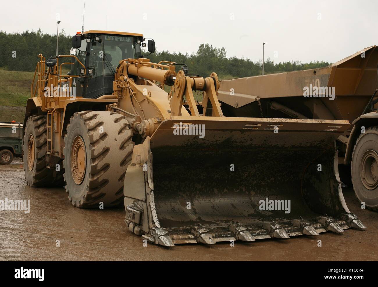 Un gommato Caterpillar pala di carico lavorando in una cava in Leicestershire Foto Stock